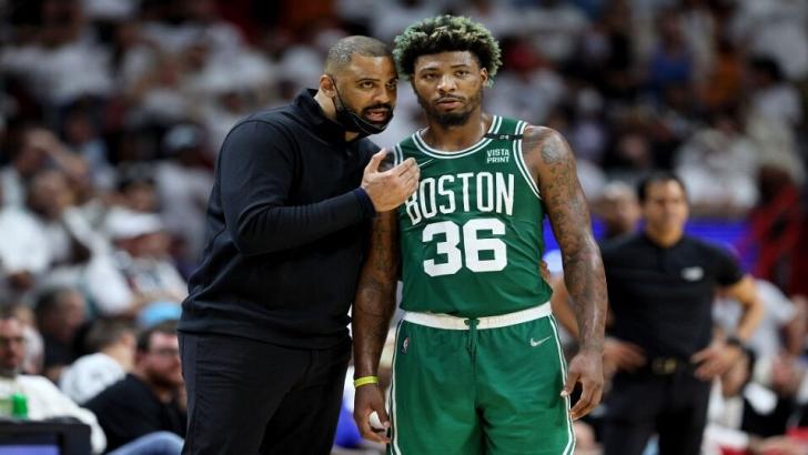 Coach Ime Udoka of the Boston Celtics talks with Marcus Smart